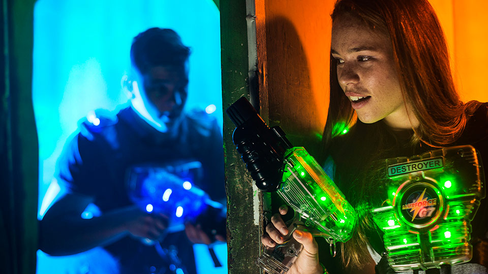 Player in laser tag corridor